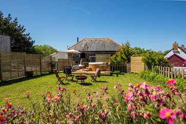 There is private parking to the left of the fence, then a hop skip and a jump up the steps brings you onto the terrace and to your front door.