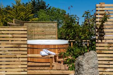 Tucked away, the hot tub is a real luxury.