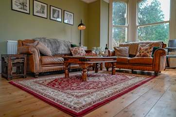 The sitting-room is situated to the front of the house and floods with light with wonderful views of the garden and beyond, not forgetting the log-burner for those colder nights.