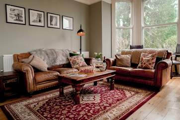 The sitting-room is situated to the front of the house and floods with light with wonderful views of the garden and beyond. Not forgetting the log-burner and the 65
