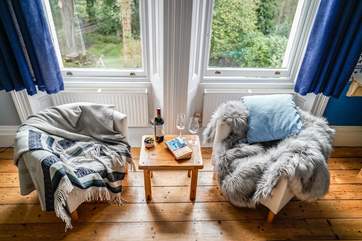A cosy reading area in bedroom 2 with views of the front garden.
