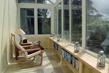 The conservatory can be accessed through the sitting-room, this is a great space to enjoy reading in the sun whilst taking in the far reaching views.