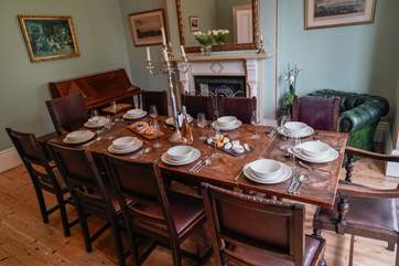 The grand dining-room offers a formal setting for the family to come together. The piano and open fire will make for a wonderful night of song and laughter.