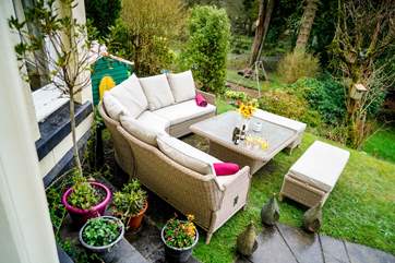 Barbecue evenings and the last of the sun can be enjoyed from this wonderful position (the furniture is situated at the top of a slope, please be careful. You can see the neighbour's garden swing and garden in this photo).