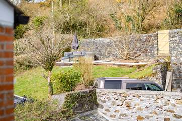 There is private parking for up to five cars and a lounge space in the garden.