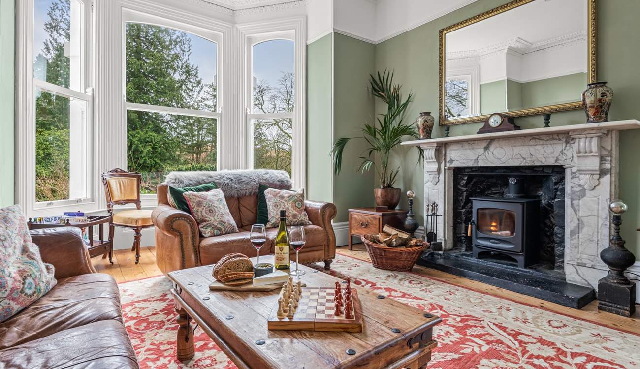 The gorgeous sitting-room is situated to the front of the house and has stunning views of the garden and beyond.  Not forgetting the log-burner and the 65