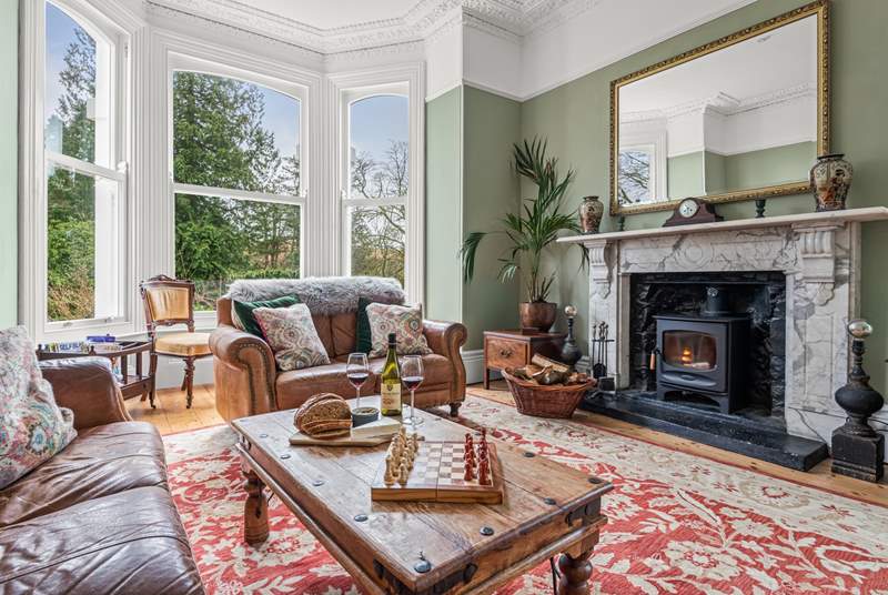 The gorgeous sitting-room is situated to the front of the house and has stunning views of the garden and beyond.  Not forgetting the log-burner and the 65