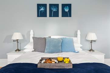 In the morning pull back the curtain and enjoy the view of the trees and skies whilst listening to the morning chorus from this glorious bed.