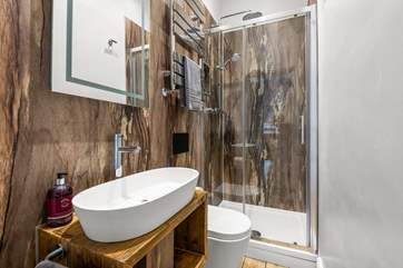 Bedroom 2 enjoys a shower en-suite that offers a touch of luxury.