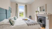 Bedroom 5 is full of period charm and far reaching views. This room also benefits from 'zip and link' beds, which can be configured as twins on request.