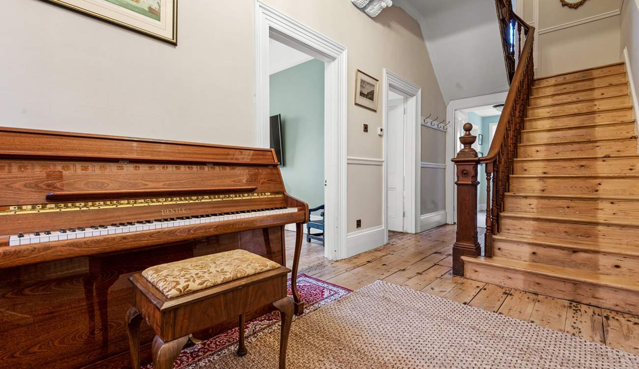 The sweeping staircase leads to the first floor.