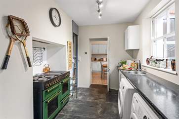 The kitchen adjoins a handy utility room.