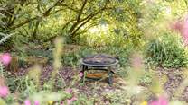 There are plenty of gorgeous hideaways to discover outside, like this delightful fire-pit.