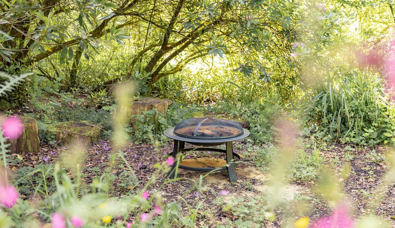 There are plenty of gorgeous hideaways to discover outside, like this delightful fire-pit.