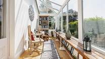 Accessed through the sitting-room, the conservatory is definitely a room with a view!