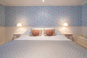 The lower ground floor bedroom with king-size bed.