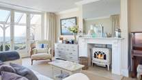 The spacious second sitting-room with wood-burner and piano. 