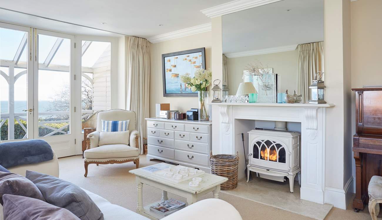 The spacious second sitting-room with wood-burner and piano. 