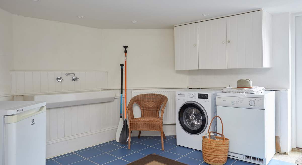 This handy utility room is great for when you come in from the beach.