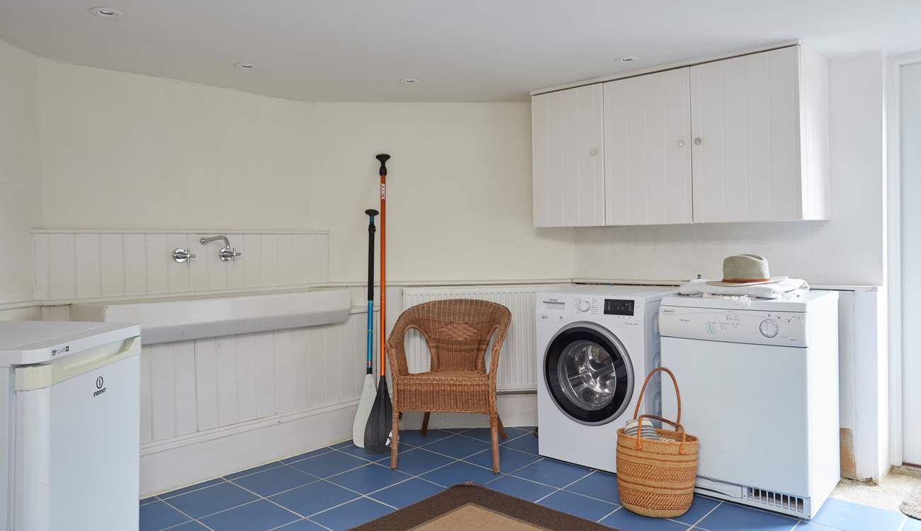 This handy utility room is great for when you come in from the beach.