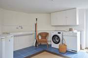 This handy utility room is great for when you come in from the beach.