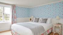 The lower ground floor bedroom with king-size bed.