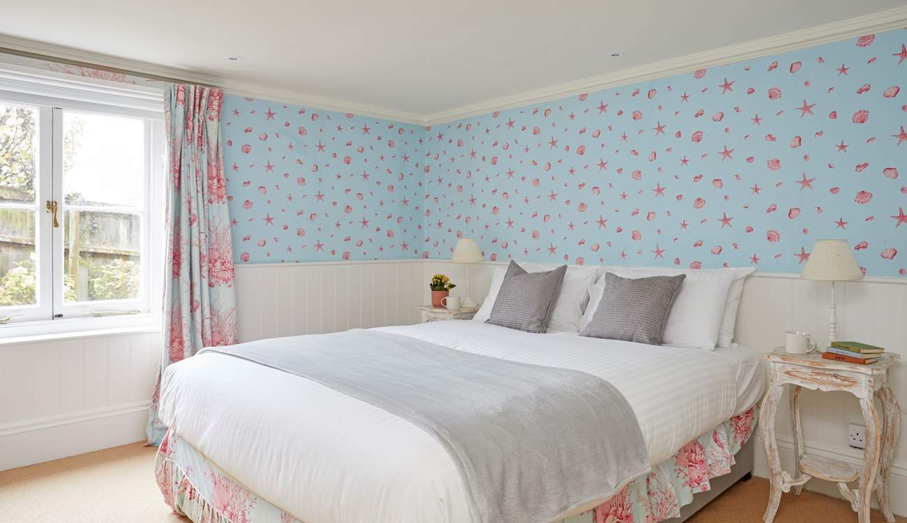 The lower ground floor bedroom with king-size bed.