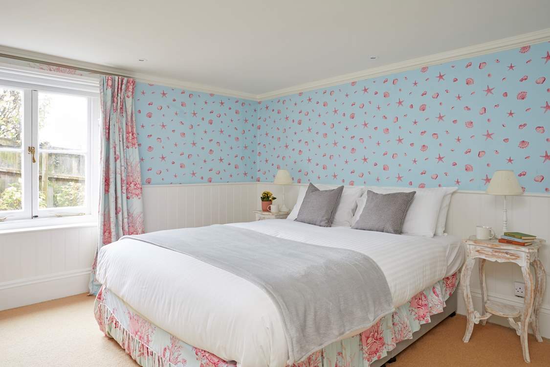 The lower ground floor bedroom with king-size bed.