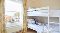 Located on the first floor this room has two sets of bunk-beds.