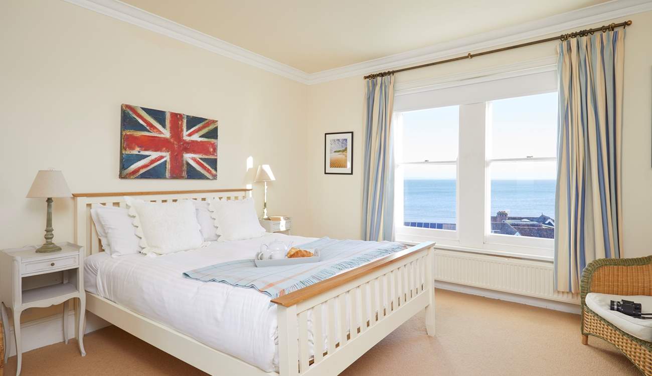 The first floor master bedroom with king-size bed and en suite shower-room.