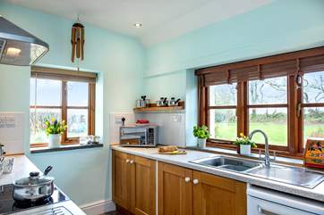 The cottage kitchen is dual-aspect so you can enjoy more of that view.