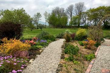 The pretty borders that edge the garden path, leading to the lawn.