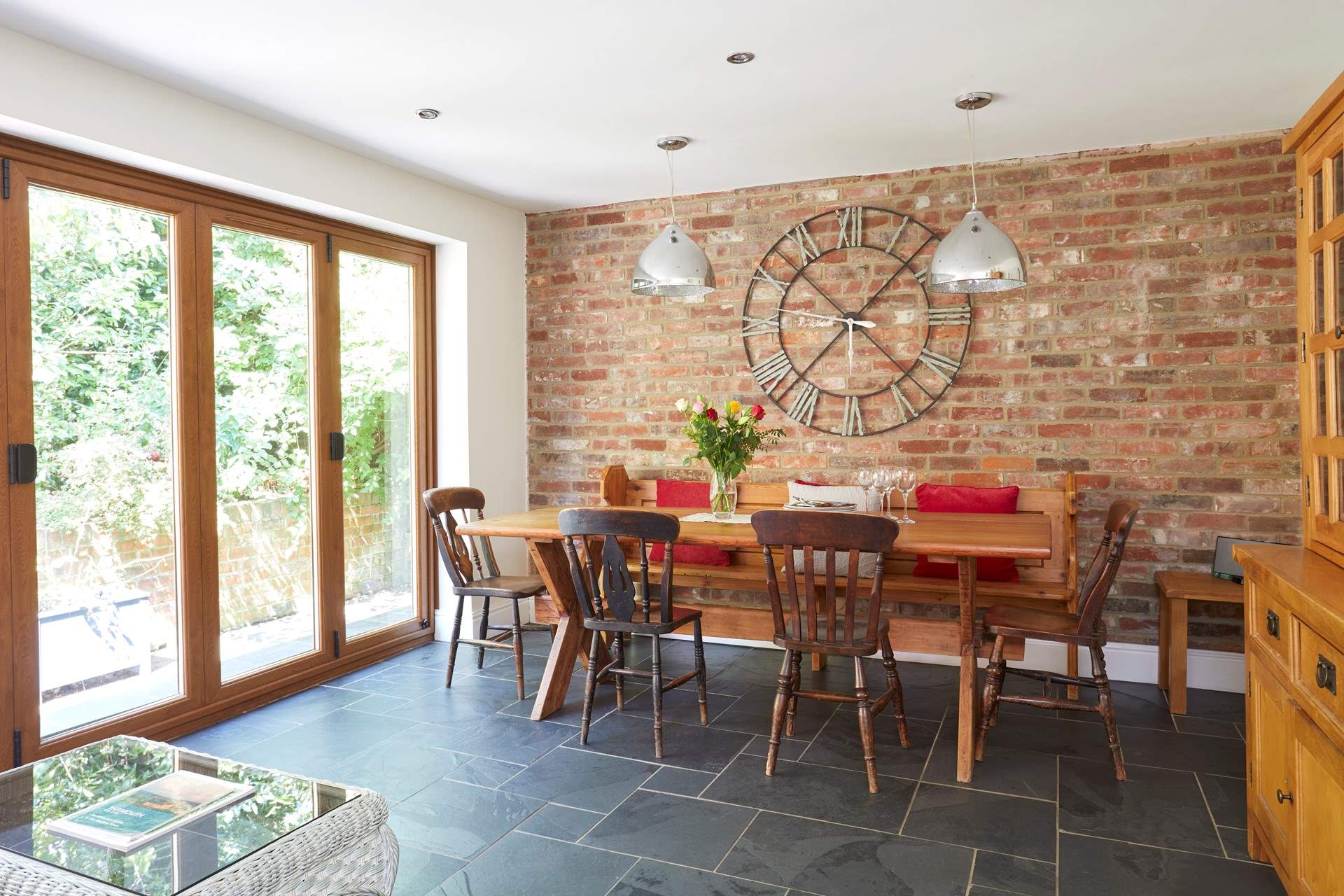 The open plan layout from the kitchen/dining-room is emphasised with the bi-folding doors leading to the patio area.