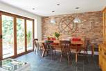 The open plan layout from the kitchen/dining-room is emphasised with the bi-folding doors leading to the patio area.