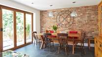The open plan layout from the kitchen/dining-room is emphasised with the bi-folding doors leading to the patio area.