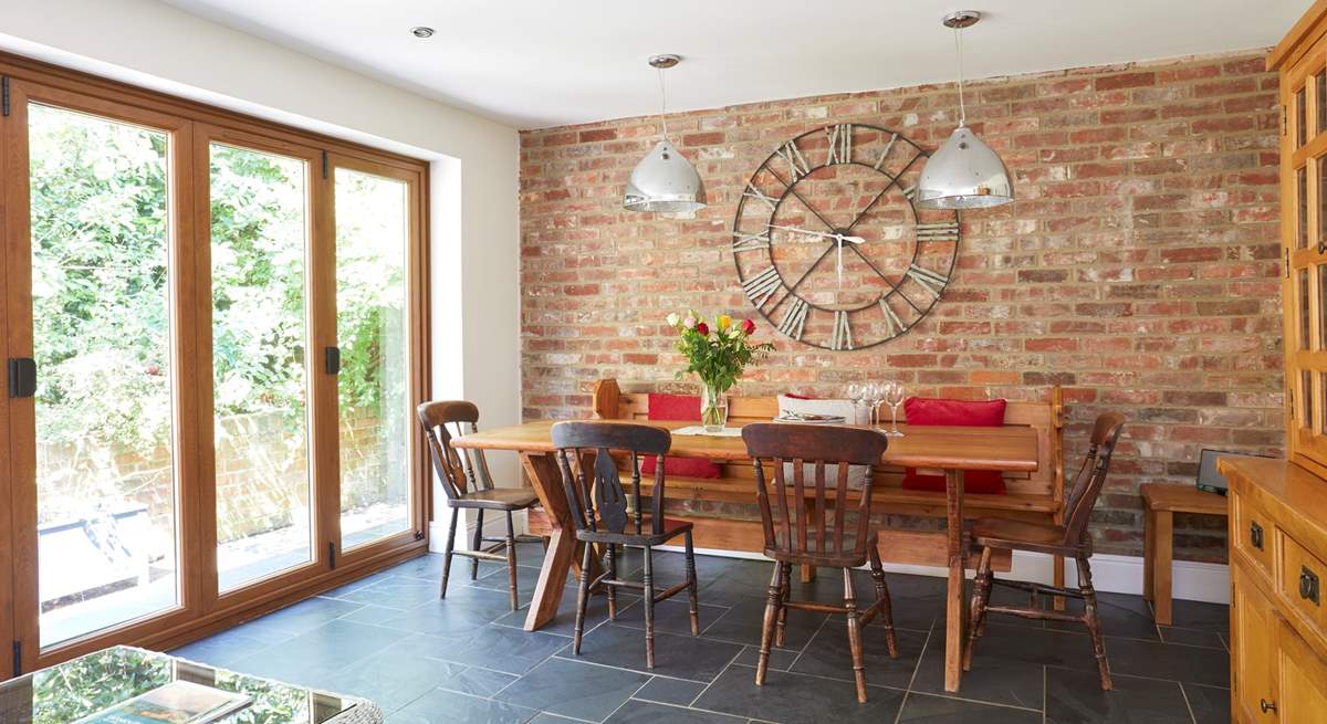 The open plan layout from the kitchen/dining-room is emphasised with the bi-folding doors leading to the patio area.