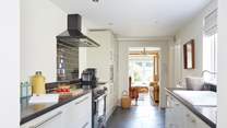 Enjoying cooking in this stylish modern kitchen. 