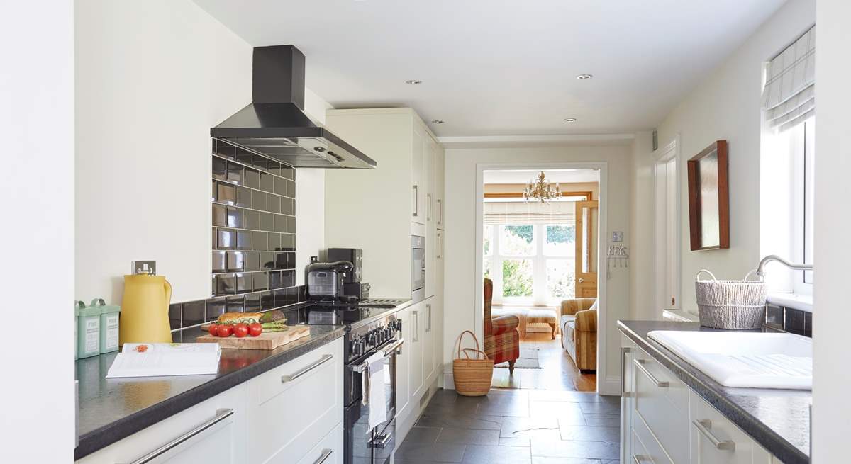 Enjoying cooking in this stylish modern kitchen. 