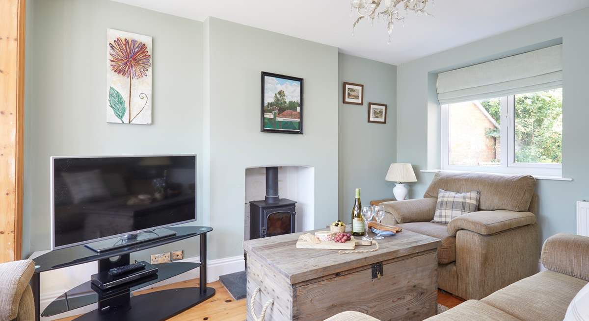 The cosy first of two sitting-rooms, ideal for family evenings spent watching a film (the wood-burner is not for guests' use).