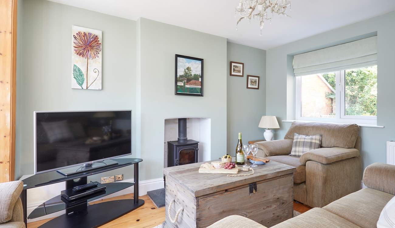 The cosy first of two sitting-rooms, ideal for family evenings spent watching a film (the wood-burner is not for guests' use).