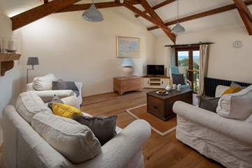 A spacious and comfy living area to relax and unwind in following a fun packed day.