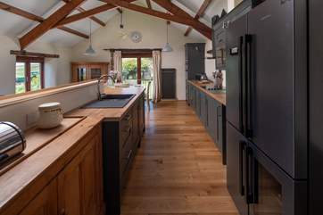 The newly fitted kitchen offers a huge fridge/freezer and oodles of space to whip up a feast. Not forgetting the fabulous wine cooler - perfect for keeping the 'supplies' cool.