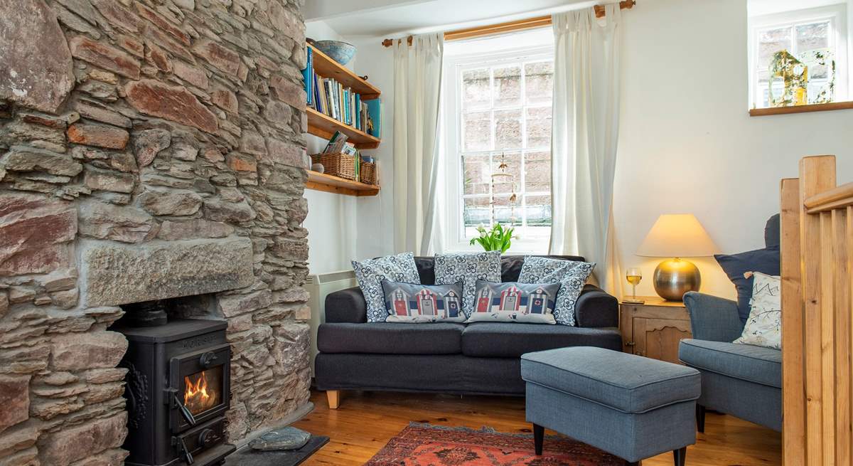 The cosy sitting-area with its toasty wood-burning makes this a great retreat all year long.