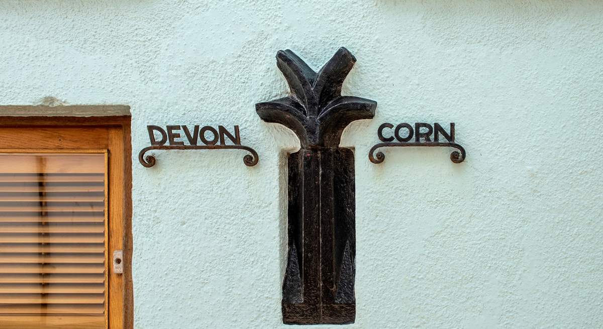 The old Devon/ Cornwall border sign which used to run between the two villages - there is now a more obvious border - the River Tamar.