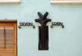 The old Devon/ Cornwall border sign which used to run between the two villages - there is now a more obvious border - the River Tamar.