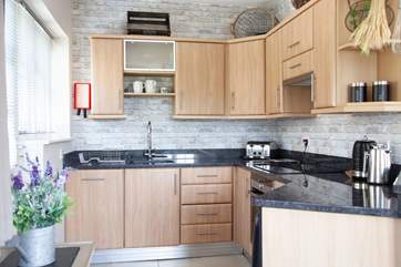 Fully equipped kitchen with granite worktops.