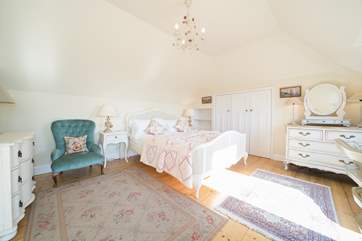 The master bedroom on the first floor, offers stunning sea views from the balcony.