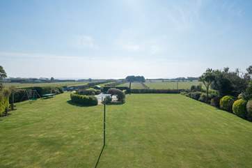 The spectacular view from the first floor master bedroom's balcony overlooking the very well maintained garden.