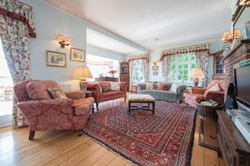 The grand sitting-room is spacious and perfect for all the family to gather after a day out exploring.
