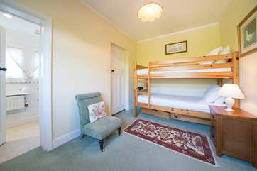 The third bedroom on the ground floor with bunk-beds and en suite shower-room.